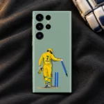 Dhoni vector mobile skin on charcoal fabric beside a cricket glove
