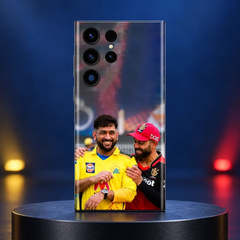 Dhoni and Virat Kohli smiling in yellow and red cricket jerseys on a mobile skin, blue studio hero