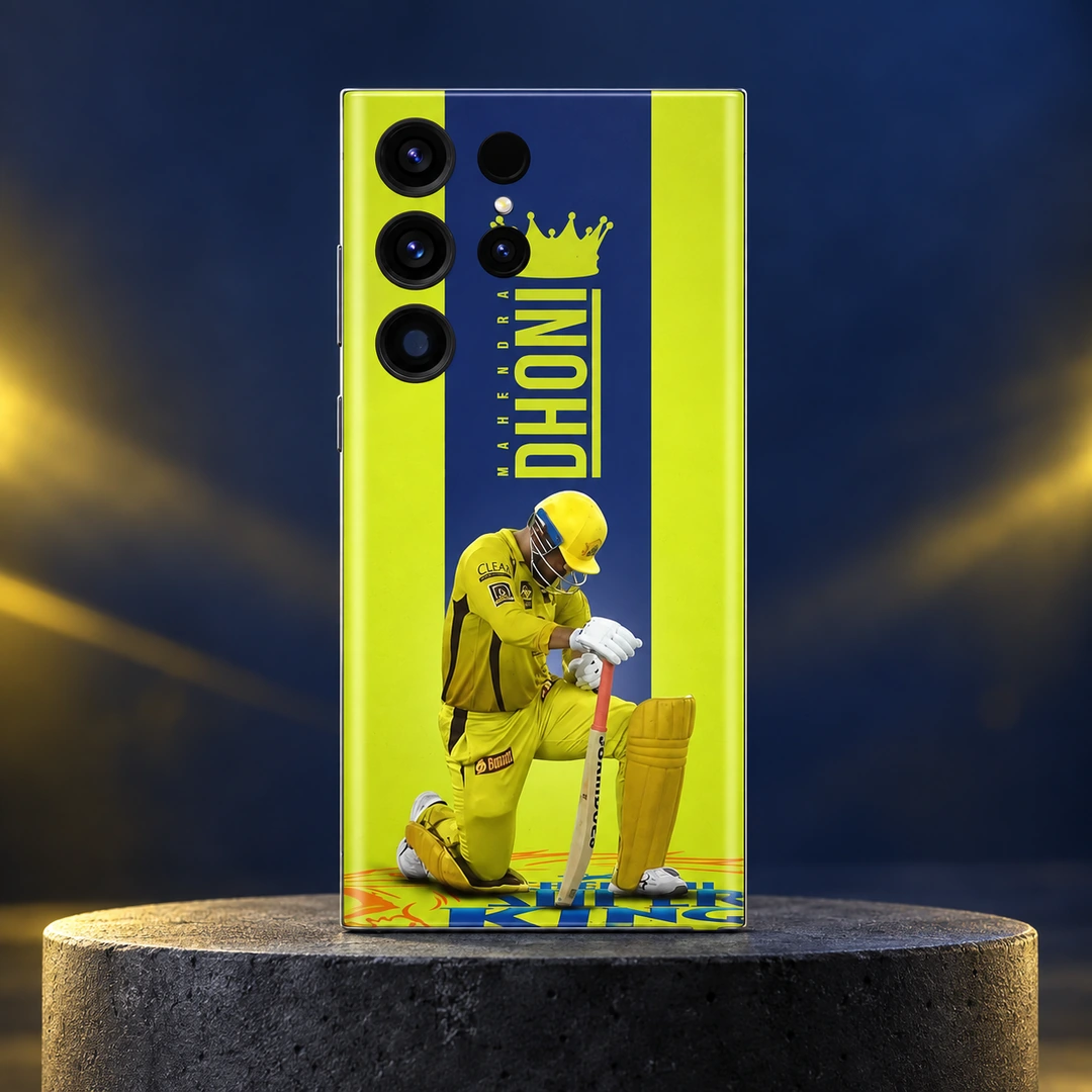 Dhoni Yellow Jersey Crown Mobile Skin - navy studio hero Yellow Dhoni photo mobile skin with crown, vertical MAHENDRA DHONI lettering and kneeling cricketer, navy studio hero