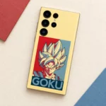 Goku mobile skin with pale yellow background, red and blue portrait and GOKU lettering, cream paper flat lay