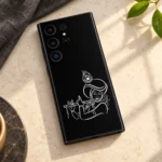 Krishna flute outline mobile skin with white turban and peacock feather line art on black – linen flat lay