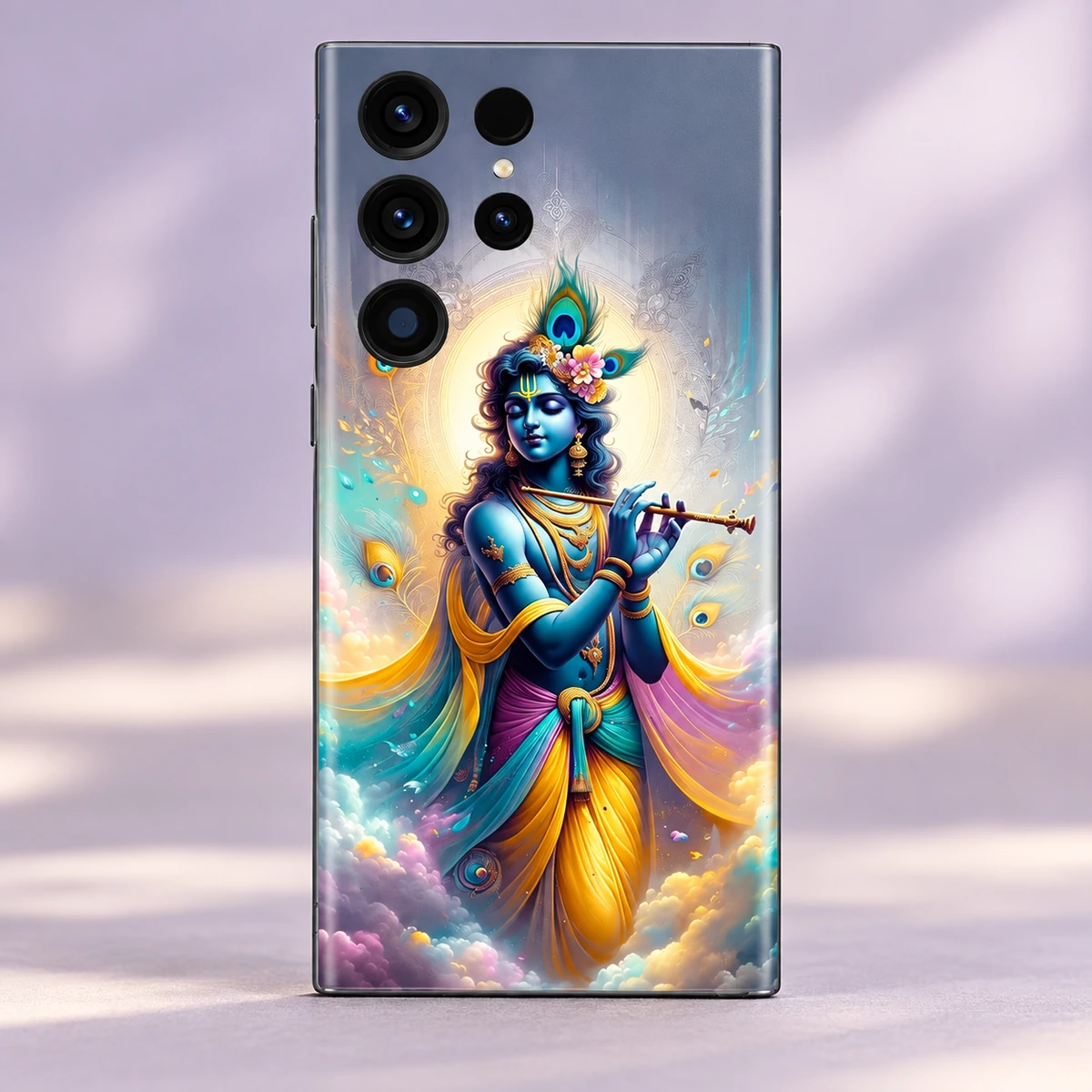 Krishna Flute Painting Mobile Skin - artwork view Blue Krishna playing flute with peacock feather crown and gold halo on a mobile skin in lilac studio light