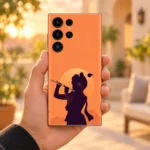 Krishna sunset silhouette mobile skin with flute and pale sun on coral orange – in-hand lifestyle