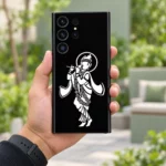 Krishna white halo mobile skin with flute and flower garland on black – in-hand lifestyle