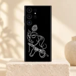 Krishna white line art mobile skin with flute and peacock feather on black on an ivory pedestal