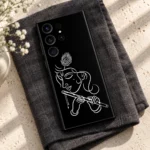 Krishna white outline phone skin with flute in a charcoal linen flatlay