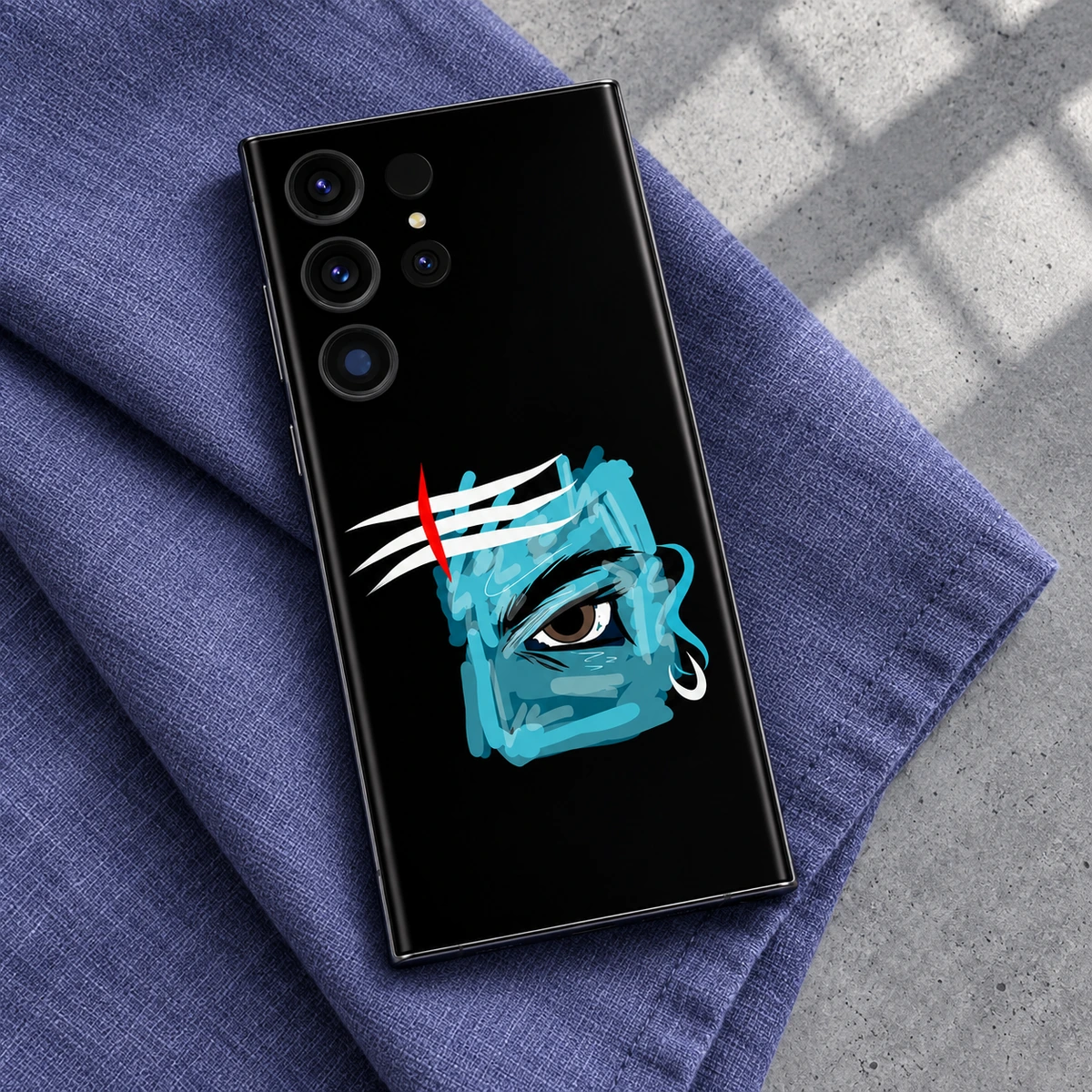 Mahadev Blue Eye Mobile Skin - Blue linen flatlay Mahadev turquoise eye artwork mobile skin in a blue linen flatlay