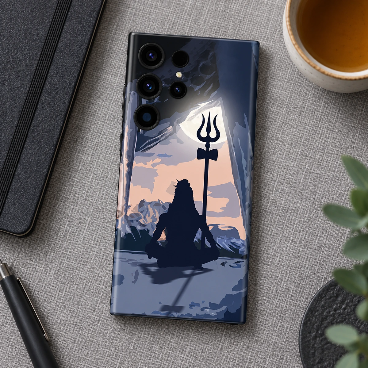 Mahadev Cave Meditation Mobile Skin - Slate flatlay Mahadev cave meditation mobile skin on grey linen beside a notebook and tea