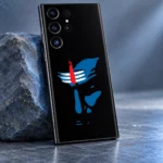Close view of blue Shiva face stencil with white tripundra and red tilak on black mobile skin