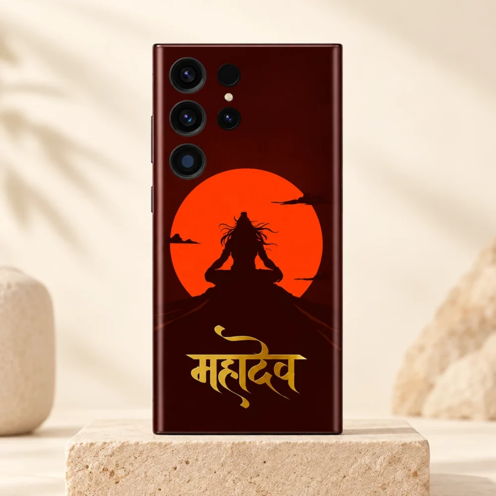 Mahadev orange sun and gold script mobile skin upright on a sandstone plinth