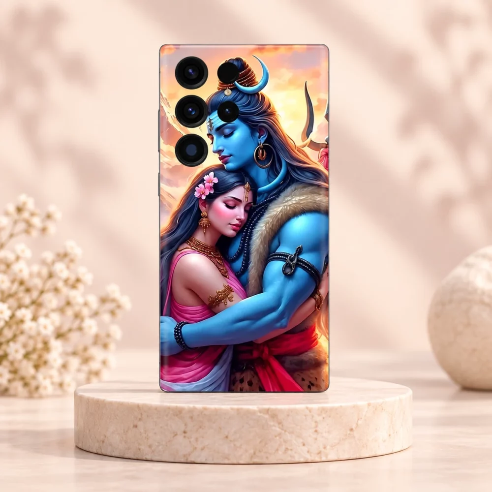 Mahadev with Parvatiji mobile skin showing Shiva and Parvati in a sunset embrace on an ivory pedestal