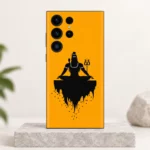 Mahadev saffron meditation mobile skin with black Shiva silhouette and trident – clean studio hero