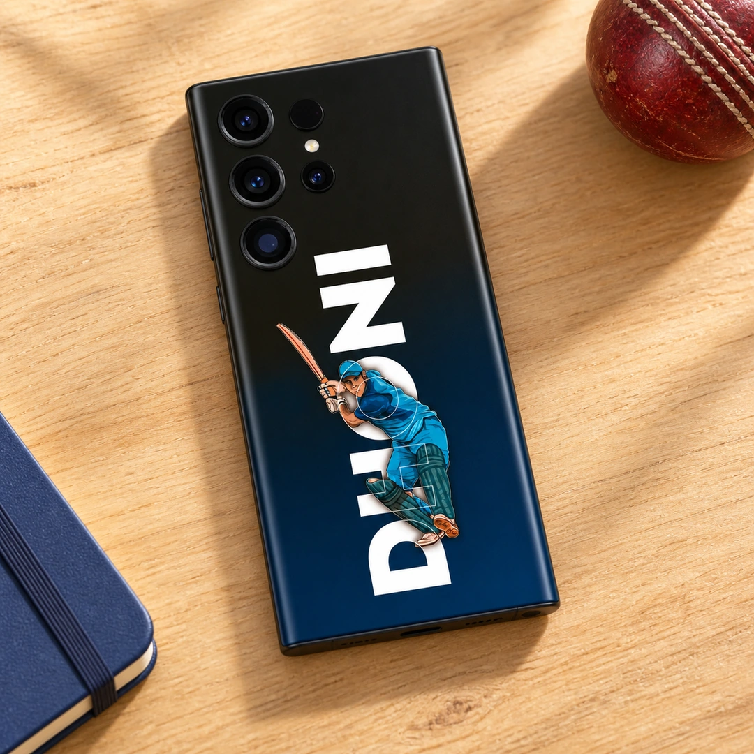 MS Dhoni Batting Mobile Skin – Cricket desk flat lay MS Dhoni mobile skin with blue batting illustration and vertical DHONI lettering, cricket desk flat lay