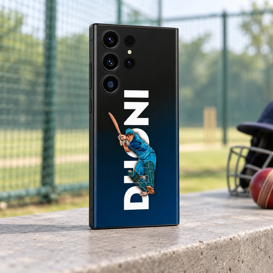 MS Dhoni Batting Mobile Skin – Practice nets angle MS Dhoni mobile skin with blue batting illustration and vertical DHONI lettering, practice nets angle