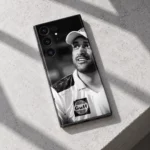 MS Dhoni Black and White Portrait Mobile Skin, stone ledge detail showing the original smiling portrait and cap