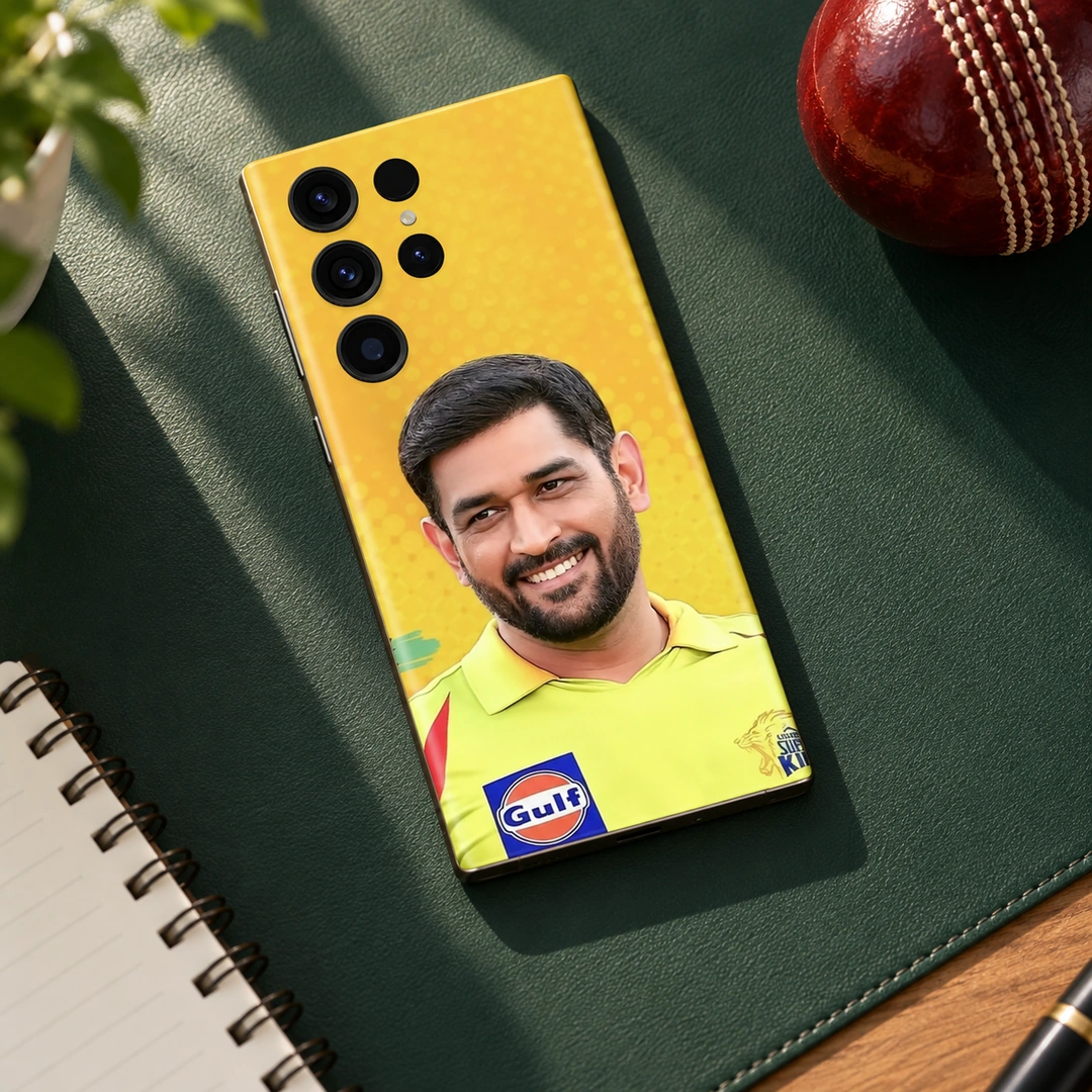 MS Dhoni Photo Mobile Skin - Cricket Desk Flat Lay MS Dhoni photo mobile skin with smiling portrait and yellow jersey, cricket desk flat lay