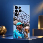 MS Dhoni trophy photo mobile skin with blue jersey and cap, blue and gold studio hero