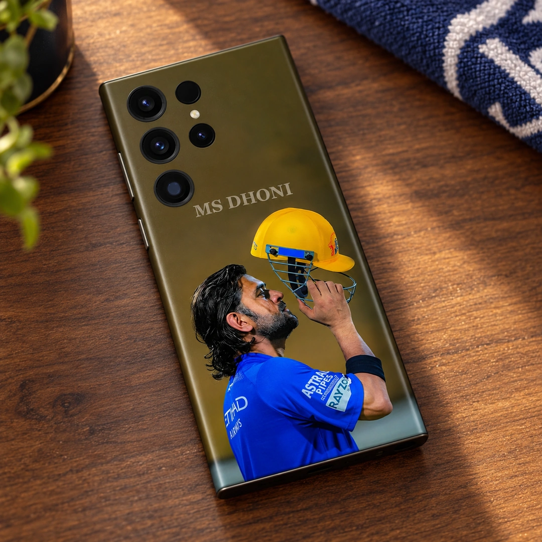 MS Dhoni Yellow Helmet Photo Mobile Skin - walnut desk lifestyle MS Dhoni photo mobile skin with blue jersey and yellow helmet, walnut desk lifestyle