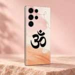 Black Om symbol with pink and peach watercolour mobile skin in a blush studio