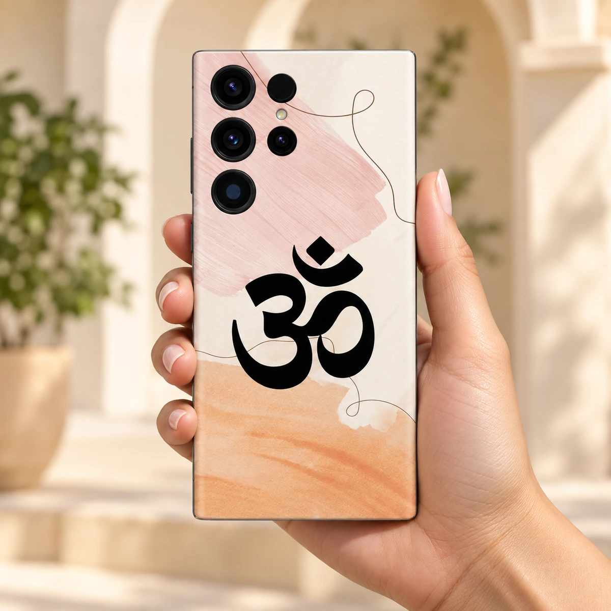 Om Mahadev Pastel Watercolour Mobile Skin - Daylight handheld Om Mahadev Pastel Watercolour Mobile Skin held in hand against cream architecture