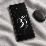 Om Mahadev white brush calligraphy mobile skin flat lay on grey linen