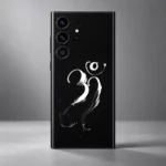 Close detail of white Om calligraphy tapered brushstrokes and ink speckles on black mobile skin