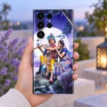 Radhe Krishna moonlight mobile skin held in hand on a softly lit terrace