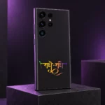 Radhe Radhe mobile skin with gradient Hindi calligraphy on charcoal black, purple studio angle