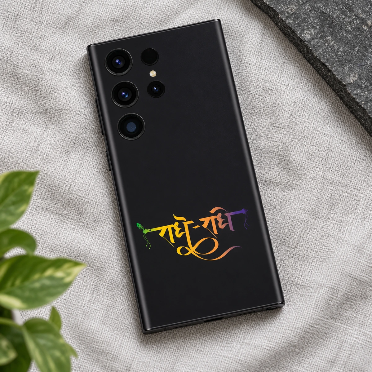 Radhe Radhe Gradient Calligraphy Mobile Skin - Linen flat lay Radhe Radhe mobile skin with gradient Hindi calligraphy on charcoal black, linen flat lay