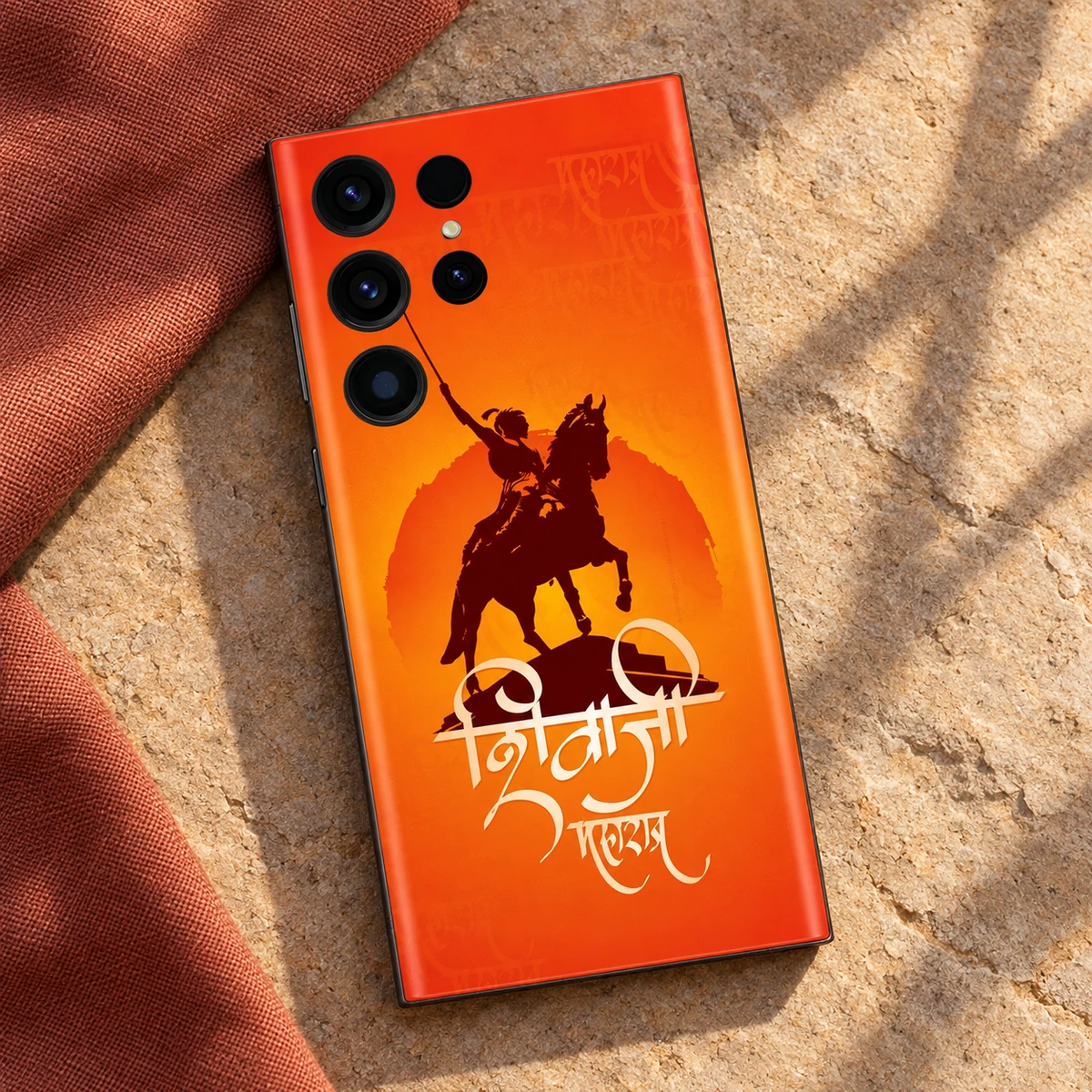 Shivaji Maharaj Saffron Horse Mobile Skin - Linen Flatlay Saffron Shivaji horse silhouette mobile skin on stone with terracotta linen