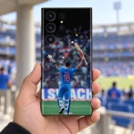 Virat Kohli 18 Bat and Helmet Celebration Mobile Skin, stadium handheld view showing VIRAT 18 with bat and helmet raised