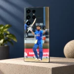 Virat Kohli mobile skin showing a raised bat and helmet celebration in blue India uniform, concrete studio angle