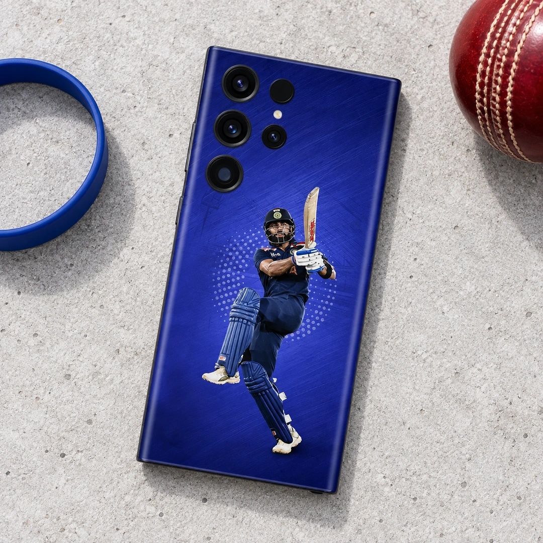 Virat Kohli Batting Blue Mobile Skin – Cricket accessories flat lay Virat Kohli batting photo mobile skin on royal blue, cricket accessories flat lay
