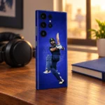 Virat Kohli batting photo mobile skin on royal blue, warm walnut desk