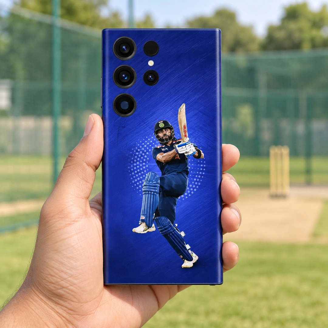 Virat Kohli Batting Blue Mobile Skin – Handheld at practice nets Virat Kohli batting photo mobile skin on royal blue, handheld at practice nets