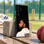 Virat Kohli black portrait mobile skin standing on a wooden bench near cricket nets
