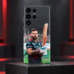 Virat Kohli photo mobile skin showing bat portrait in black-and-red cricket jersey, red accent studio hero