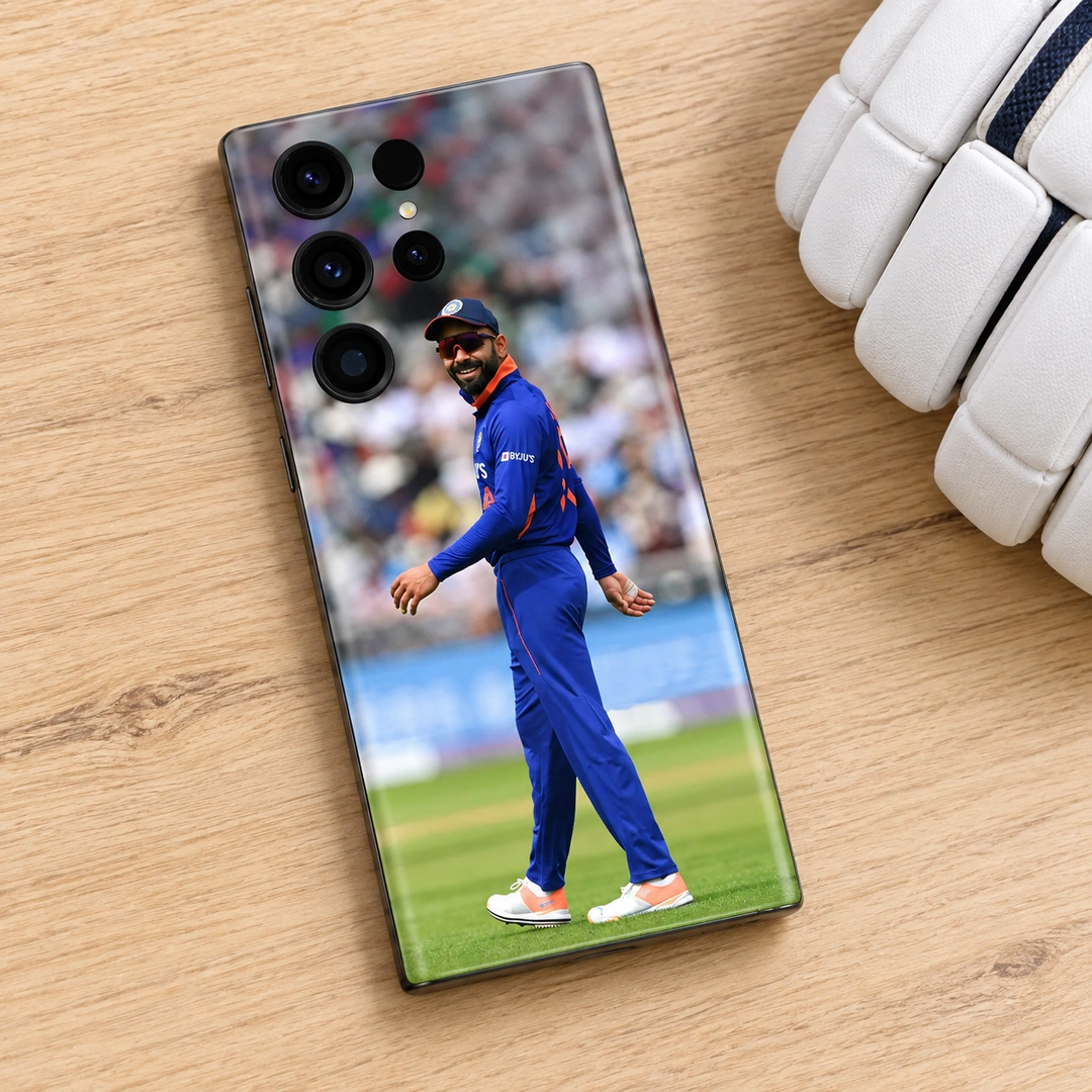 Virat Kohli Blue Jersey Photo Mobile Skin - Wood Flat Lay Virat Kohli Blue Jersey Photo Mobile Skin shown in a wood flat lay setting