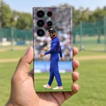 Virat Kohli Blue Jersey Photo Mobile Skin shown in a cricket net handheld setting