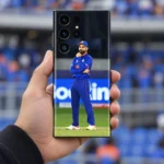 Virat Kohli full-body field photo mobile skin in blue cricket uniform, handheld stadium view