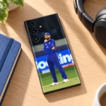 Virat Kohli full-body field photo mobile skin in blue cricket uniform, wood desk view