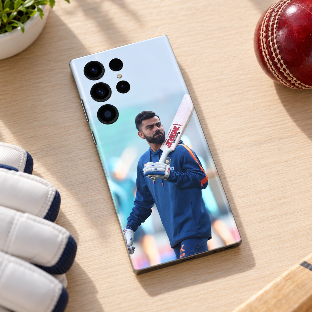 Virat Kohli Blue Training Photo Mobile Skin - Pale Wood Cricket Desk Virat Kohli mobile skin with blue training kit and bat, pale wood cricket desk