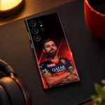Virat Kohli crossed-arms portrait mobile skin in red and black, evening desk