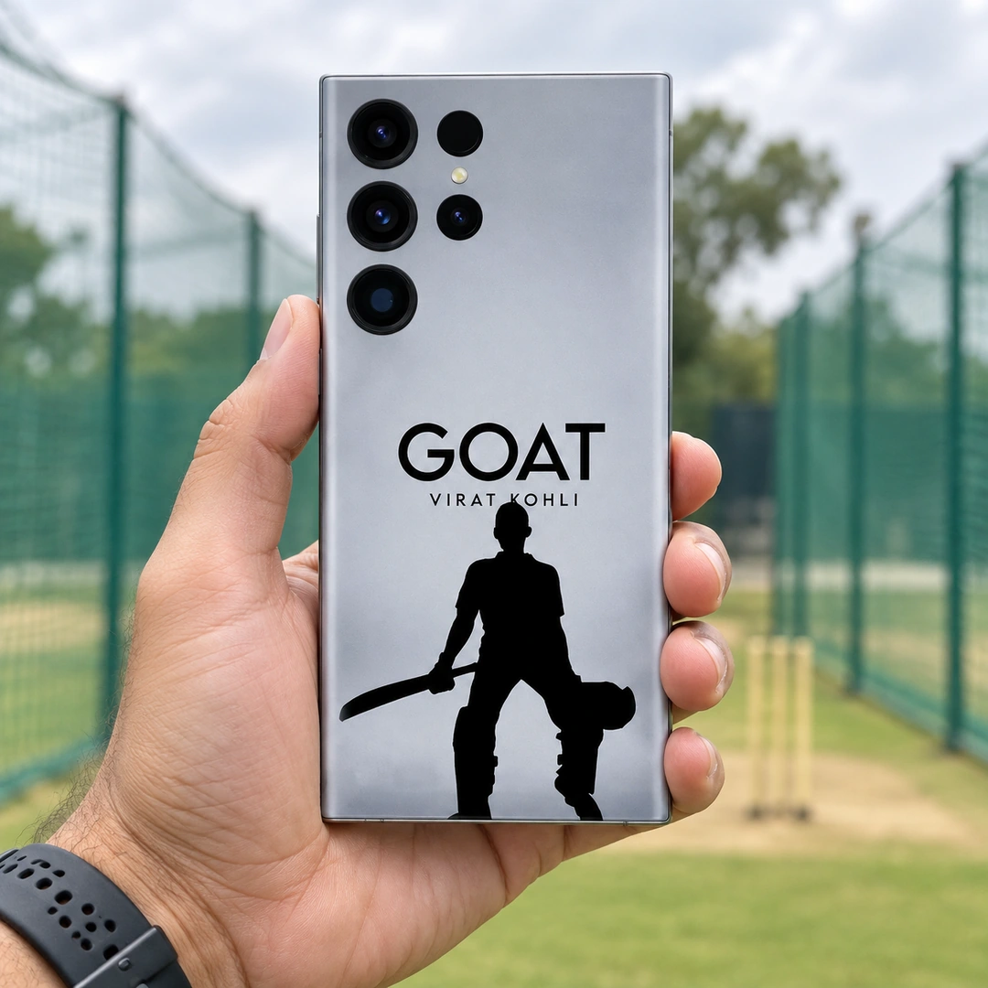 Virat Kohli GOAT Mobile Skin – practice nets handheld view Silver-gray Virat Kohli GOAT mobile skin with black cricketer silhouette, practice nets handheld view