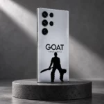 Silver-gray Virat Kohli GOAT mobile skin with black cricketer silhouette, monochrome studio angle