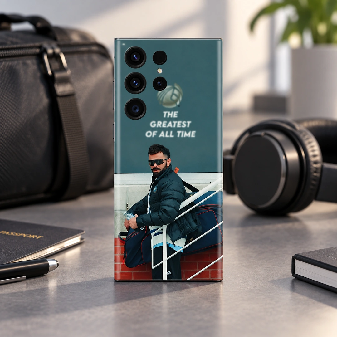 Virat Kohli Photo Mobile Skin - Travel desk view Virat Kohli photo phone skin with THE GREATEST OF ALL TIME quote, travel desk view