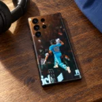 Virat Kohli King 18 mobile skin with jumping celebration photo, cafe tabletop