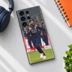 Virat Kohli navy India kit celebration mobile skin in desk flat lay setting