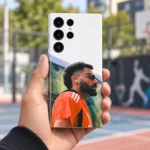 Virat Kohli photo mobile skin with orange shirt portrait and white upper design, handheld outdoor view