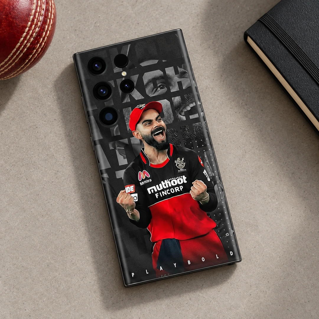 Virat Kohli Play Bold Mobile Skin – Cricket desk flat lay Virat Kohli red and black Play Bold mobile skin, cricket desk flat lay